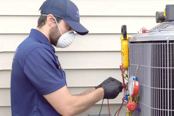 Image illustrates n man is checking Gas pressure in AC outer for Air conditioning repair.