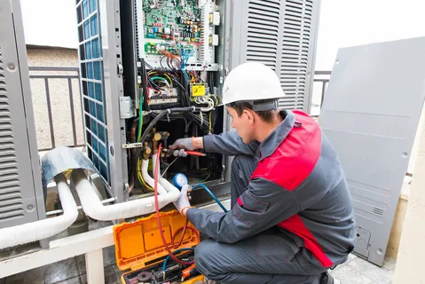 A man is repairing AC outer showing Air conditioning Repair Plant City.